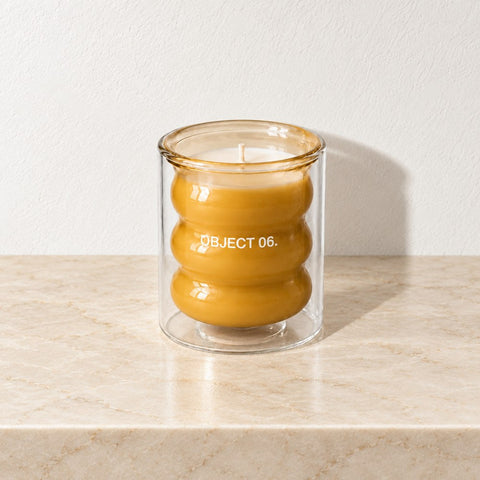 Bougie pêche musc — marbre beige harmonisé