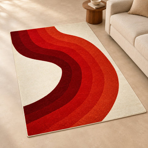 Tapis Blish courbes chaudes — mise en situation illustrative avec canapé