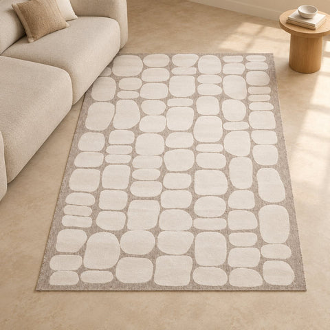 Tapis Galet relief japandi — mise en situation illustrative avec canapé