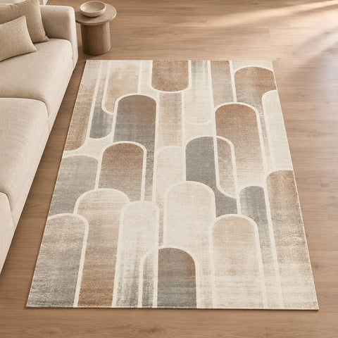Tapis Rivoli aquarelle douce — mise en situation illustrative avec canapé